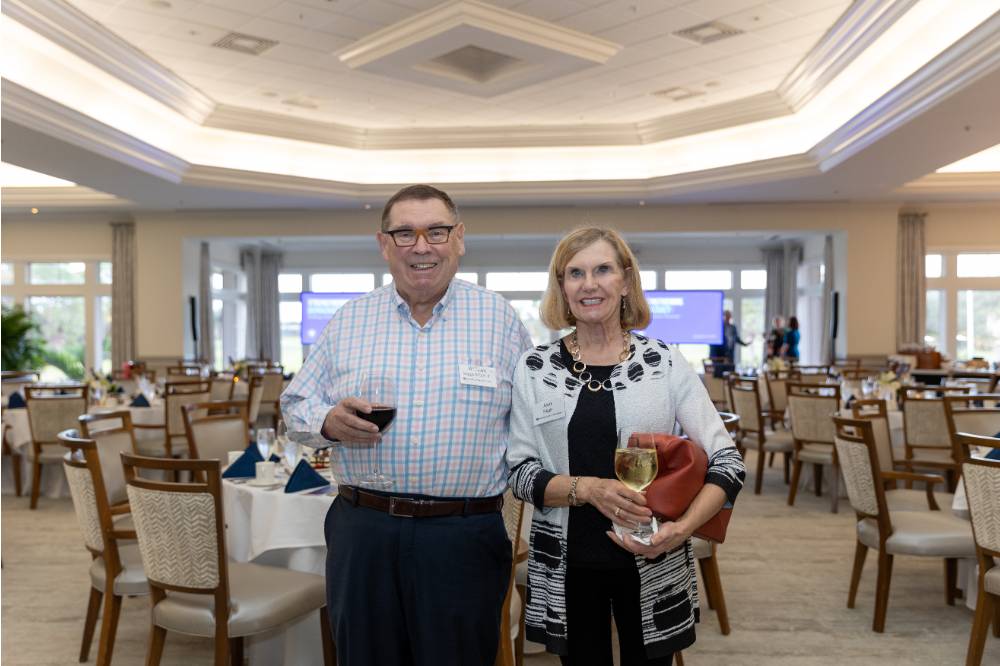 William and Jean Suggs, standing together and smiling for camera